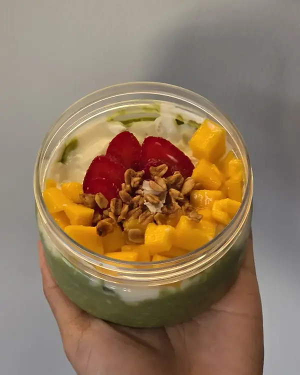 Overnight oats topped with mango, strawberry and granola